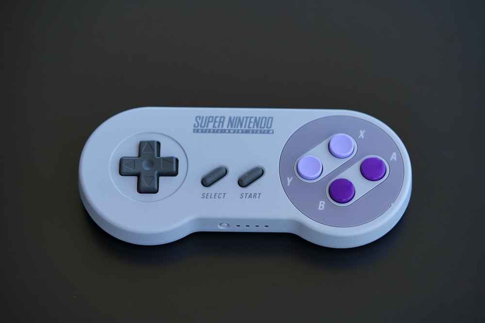 white and black game controller