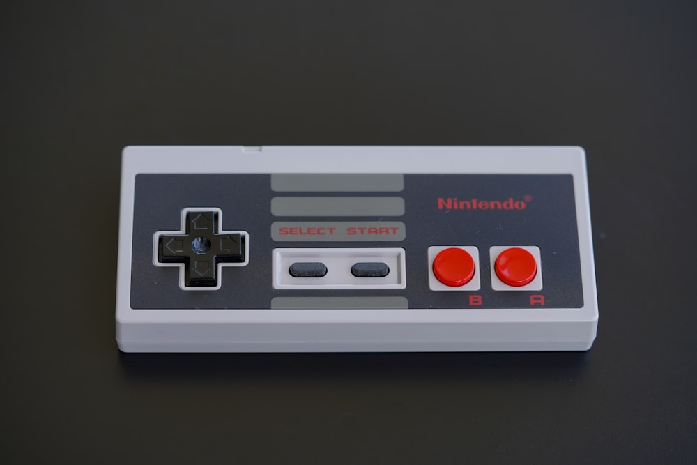 white and black nintendo game controller