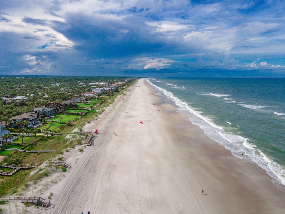 people walking on beach during daytime