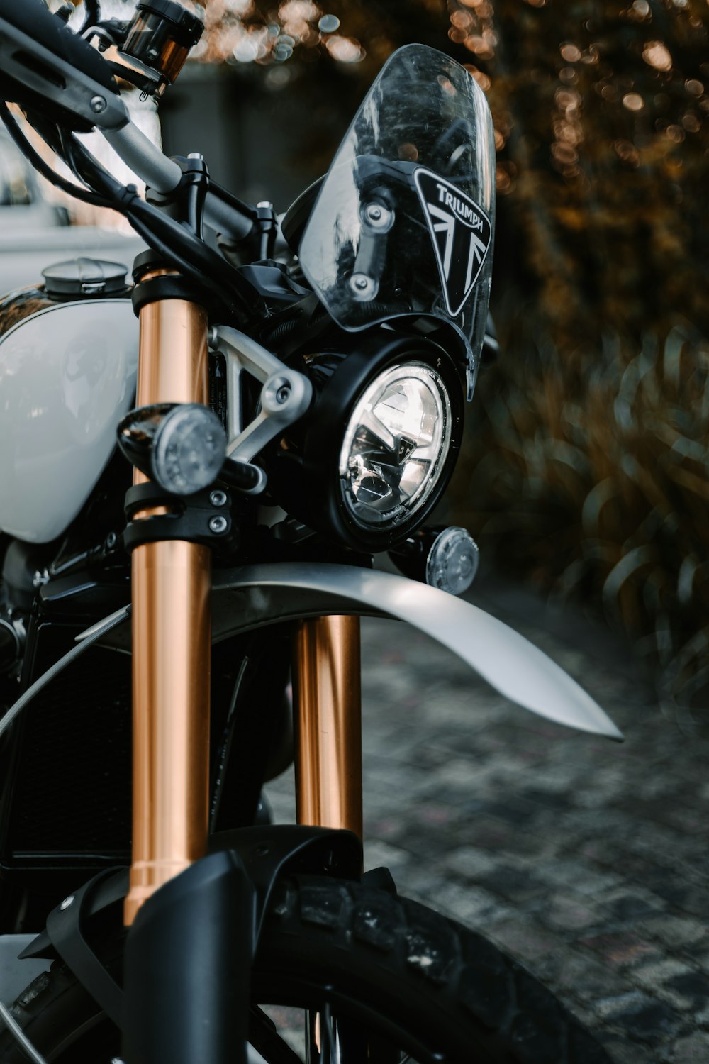 black and silver motorcycle on gray concrete floor