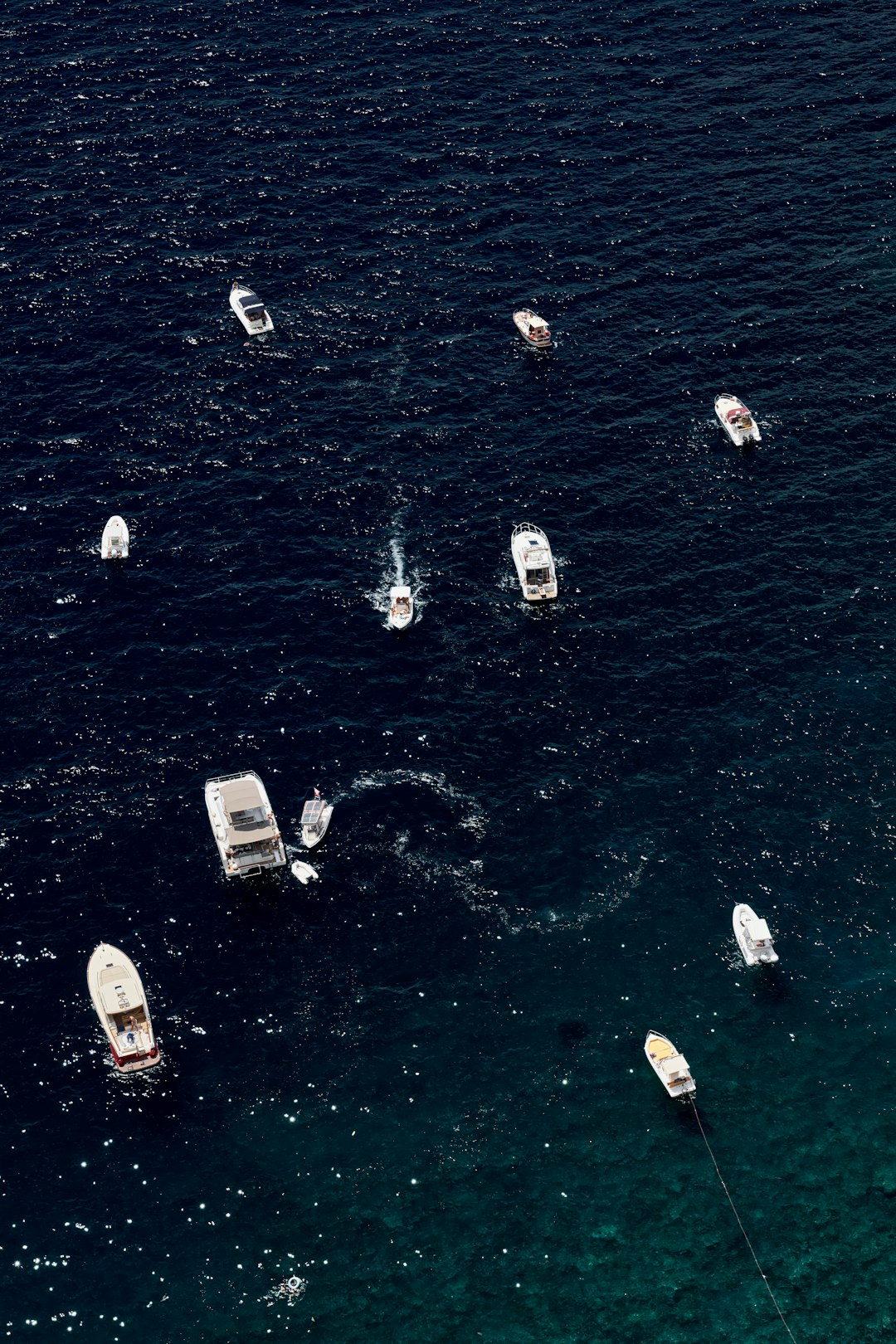 white boats on body of water during daytime