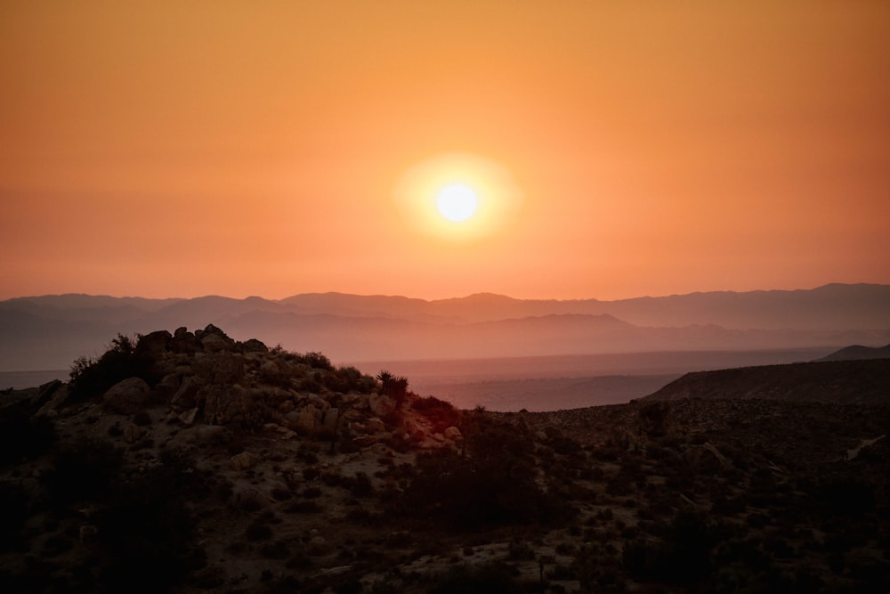 silhouette of mountains during sunset