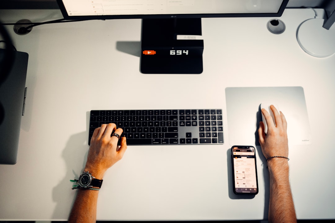 person holding silver and black laptop computer