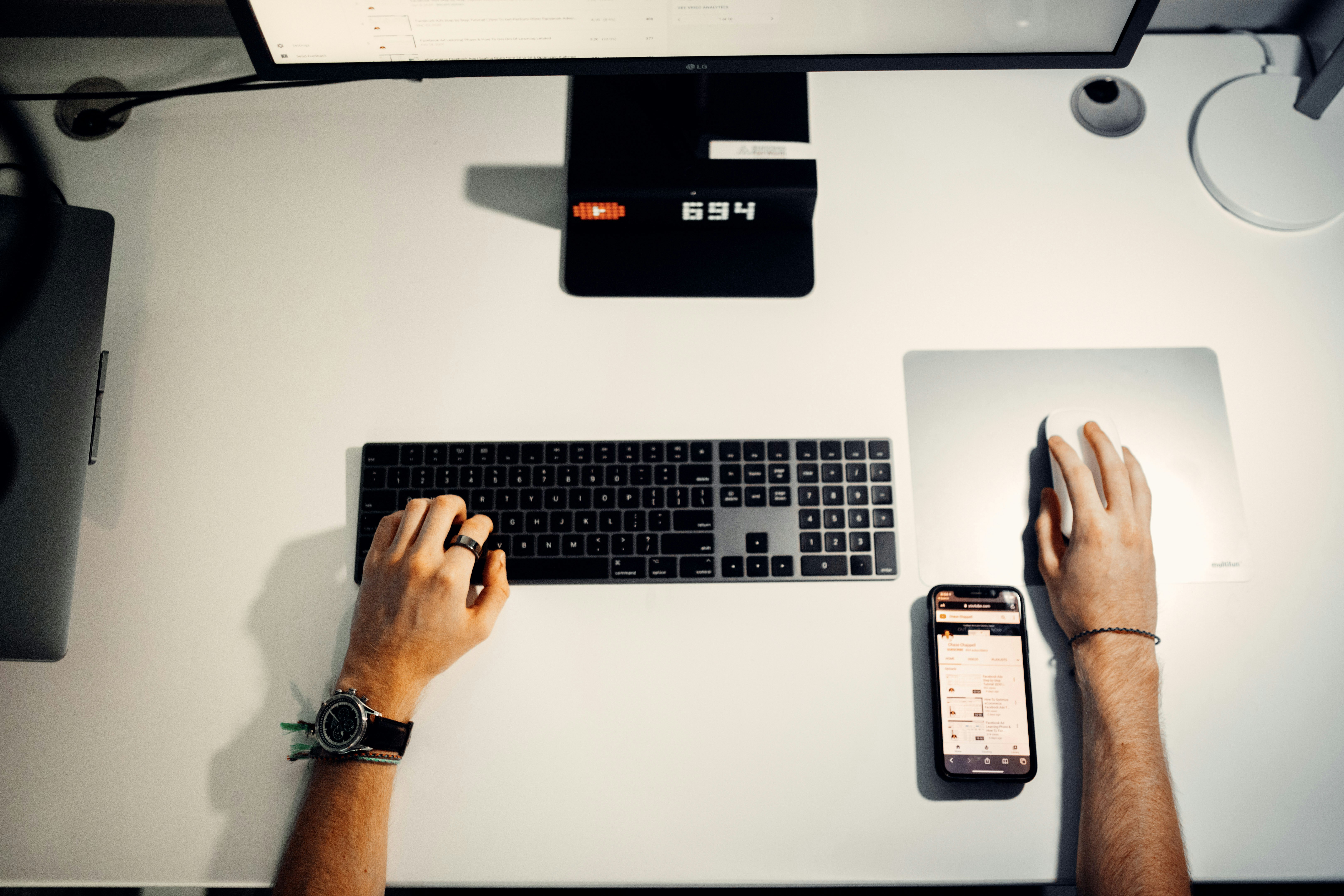 overhead shot of modern office desk with laptop user editing electronic forms