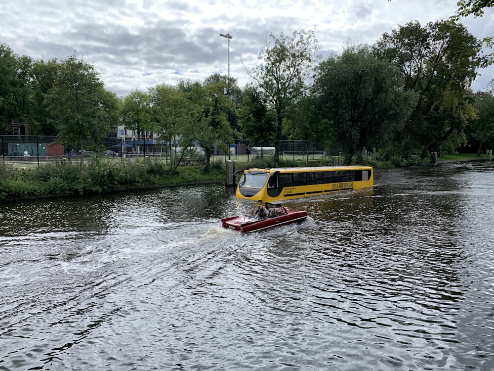 yellow and red boat on water