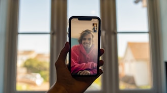 person holding black iphone 5