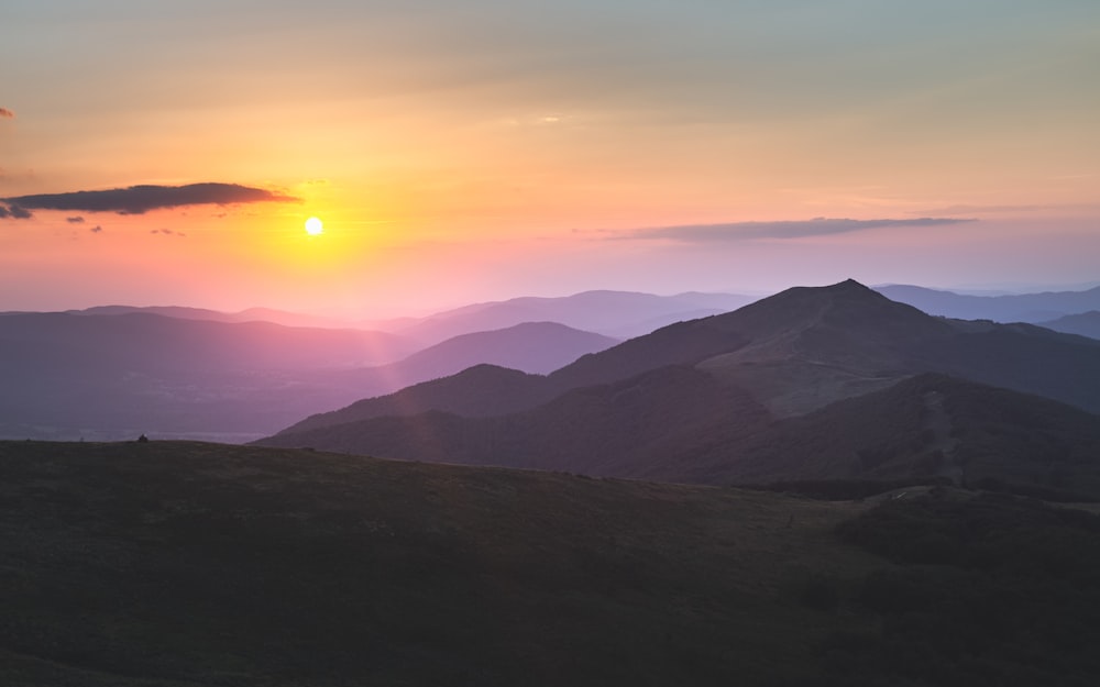 silhouette of mountains during sunset