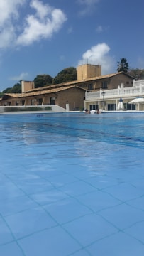 A residential pool setup with clear blue water.