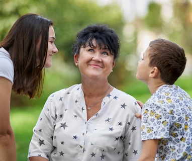 woman in white and black floral button up shirt smiling