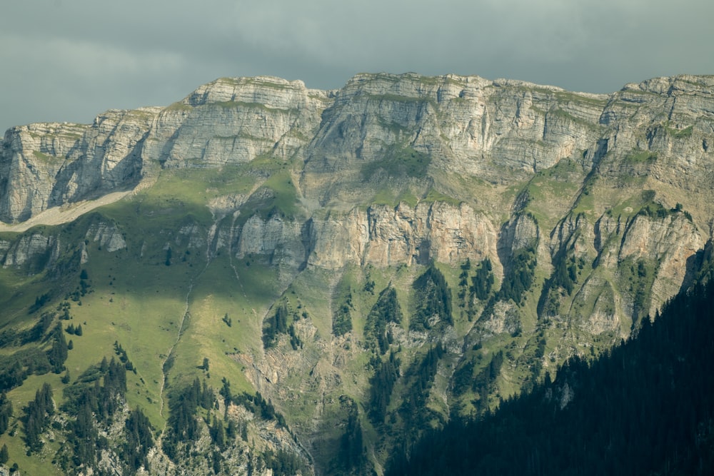 a view of a mountain range with a cloudy sky