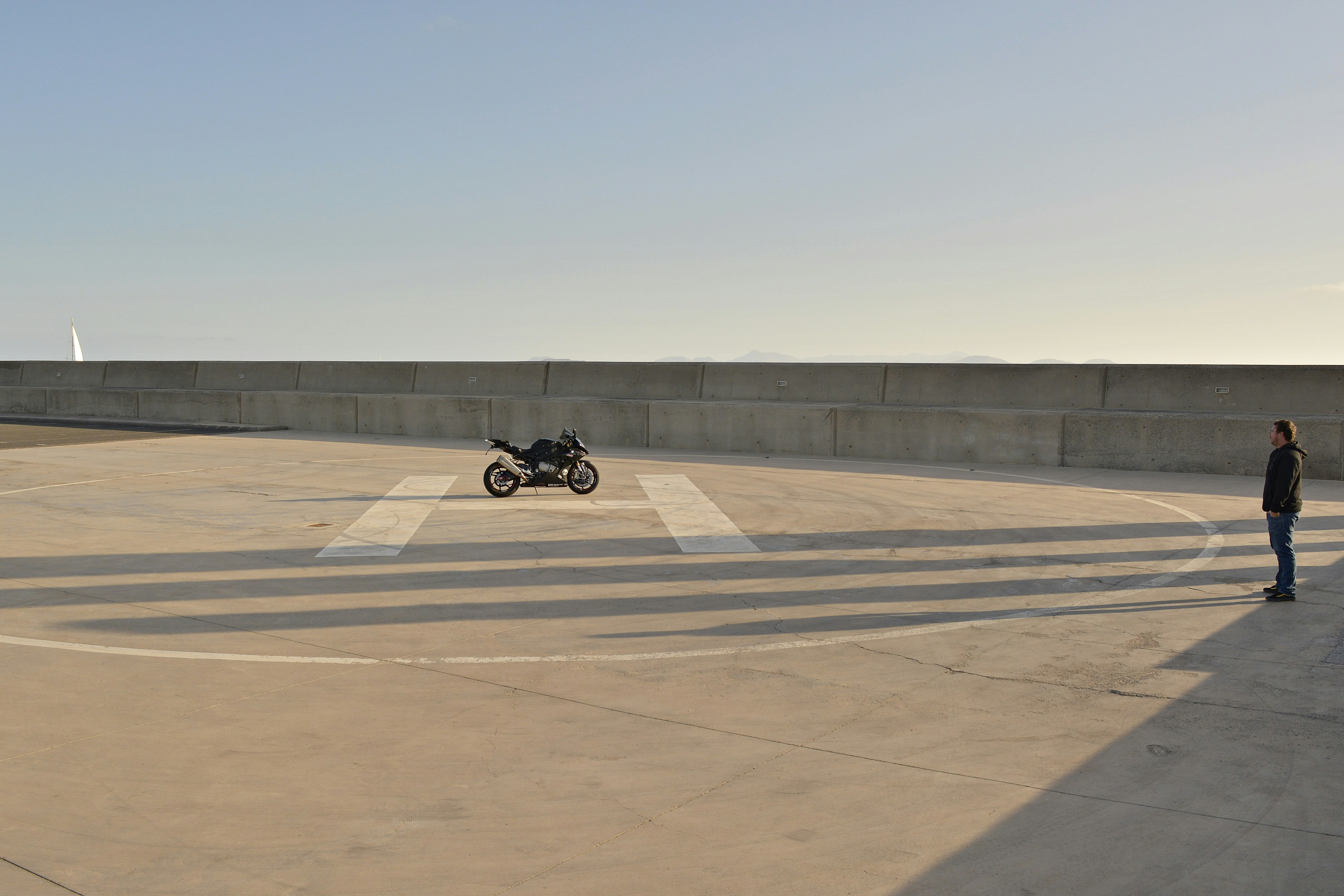 black motorcycle on brown field during daytime
