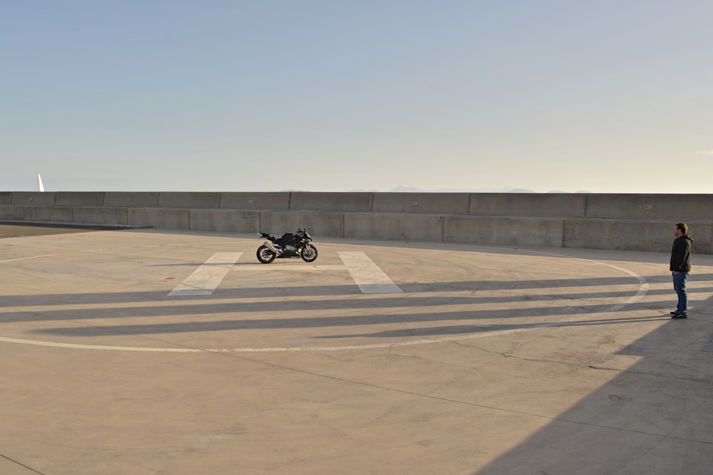 black motorcycle on brown field during daytime