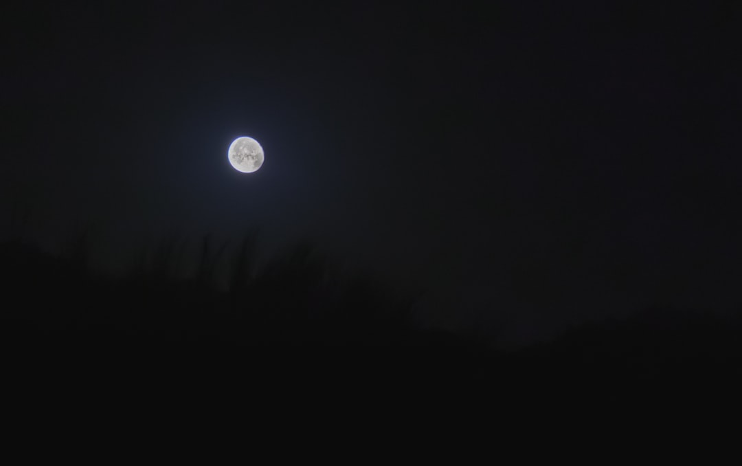 full moon in dark night sky