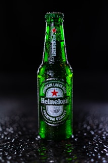 heineken bottle on black and white marble table
