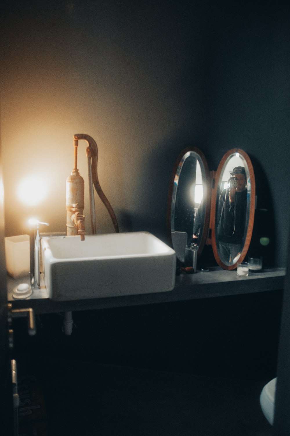 white ceramic sink with stainless steel faucet