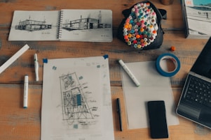 white printer paper beside black smartphone