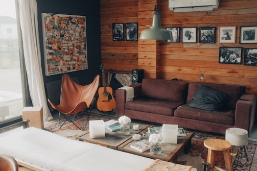 brown sofa near white coffee table