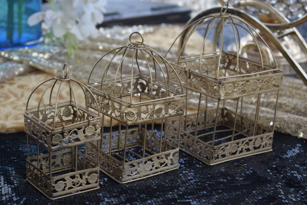 Luxurious gold bridal set with intricate filigree work, showcased on a champagne gold satin fabric.