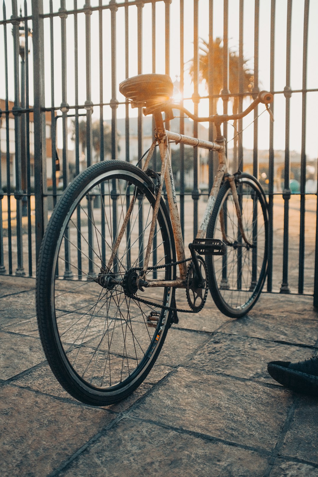 black bicycle parked on sidewalk during daytime