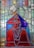 A stained glass artwork featuring a figure adorned in blue and red robes, with detailed geometric patterns. The figure has a serene expression, positioned in a praying gesture, and is crowned. Various hues of green, yellow, and blue form the background, enhancing the composition with a celestial halo effect.