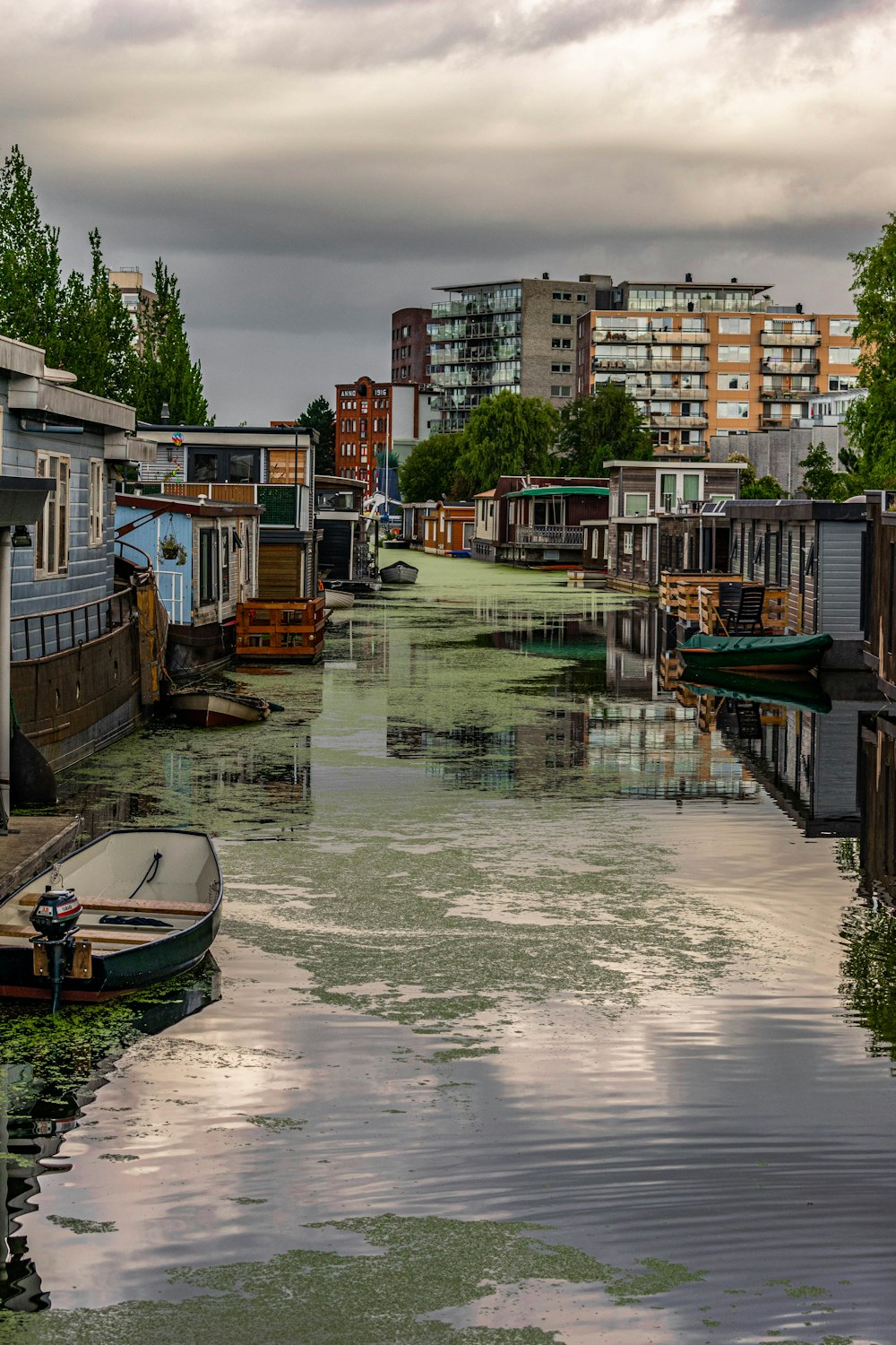 boat on water near buildings during daytime