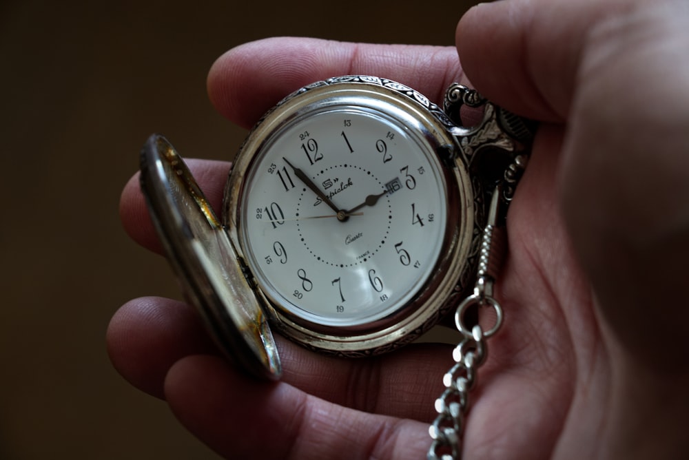 silver and gold analog watch