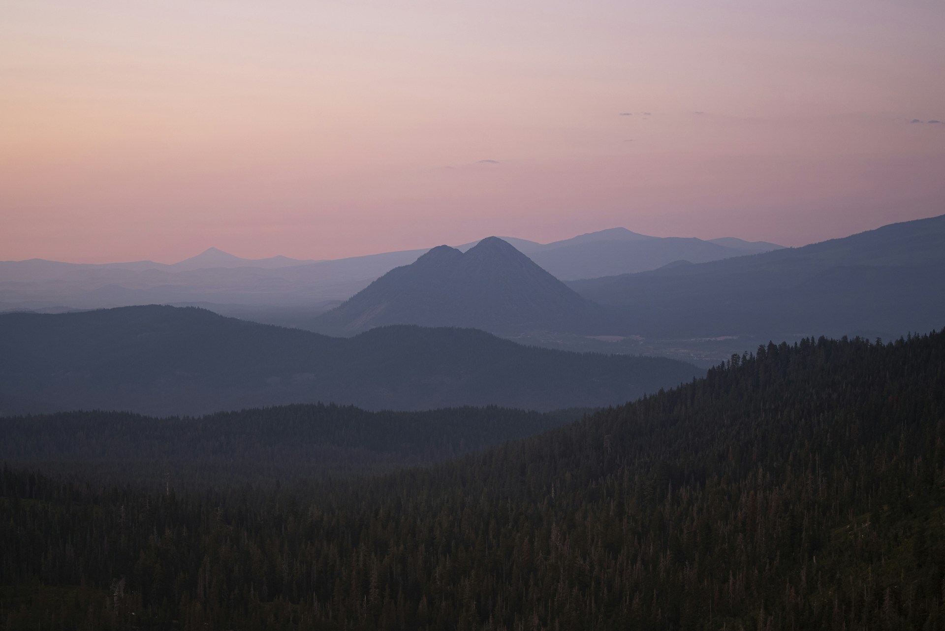 a view of a mountain range at sunset