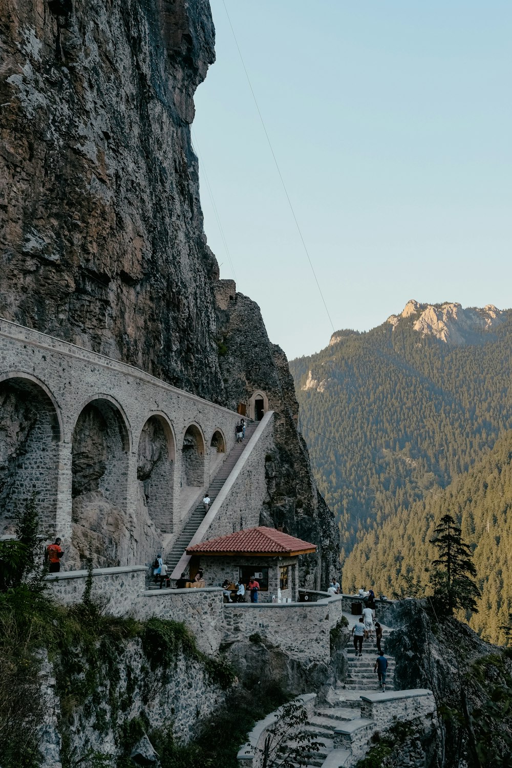 white and brown concrete bridge over the mountain