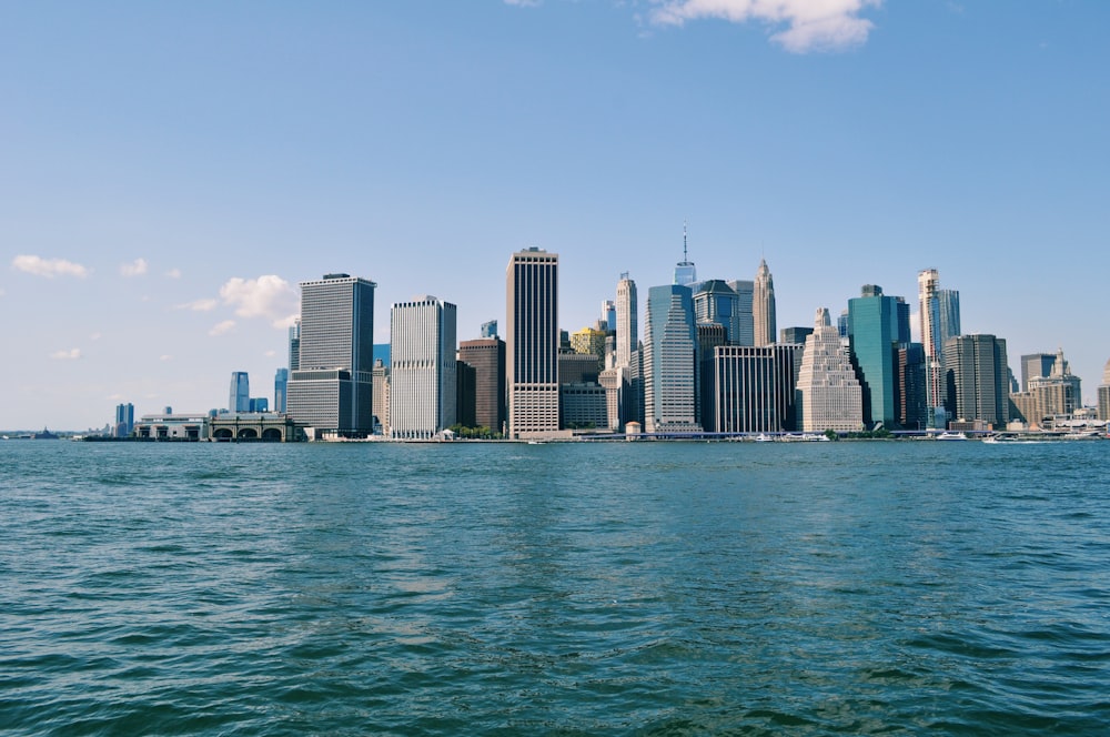 city skyline across body of water during daytime