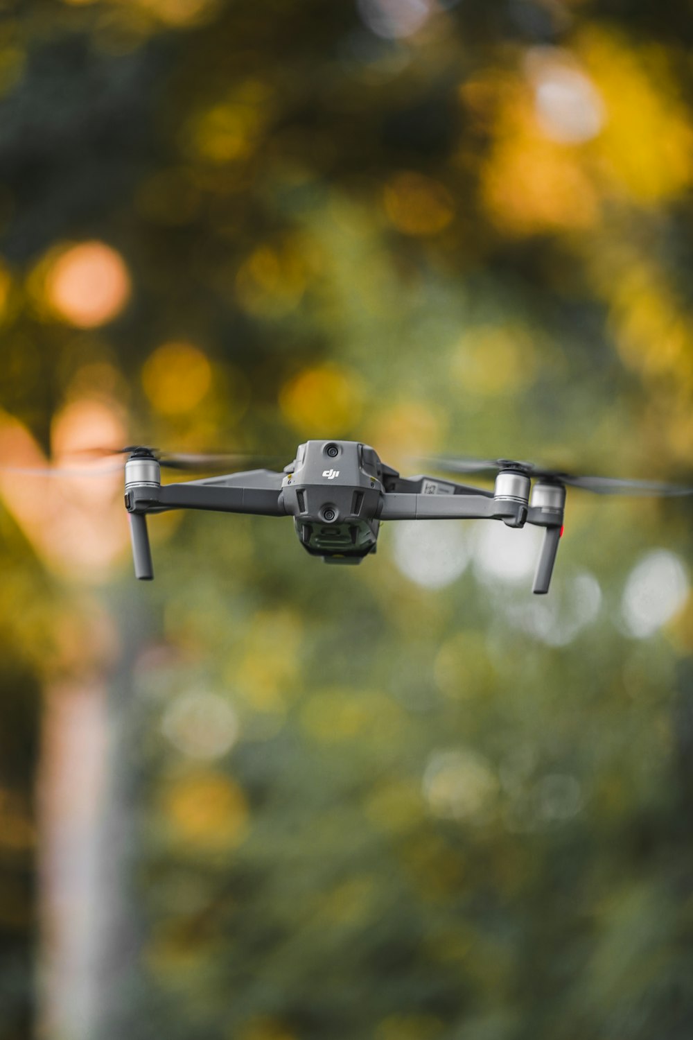 black and gray drone in mid air during daytime