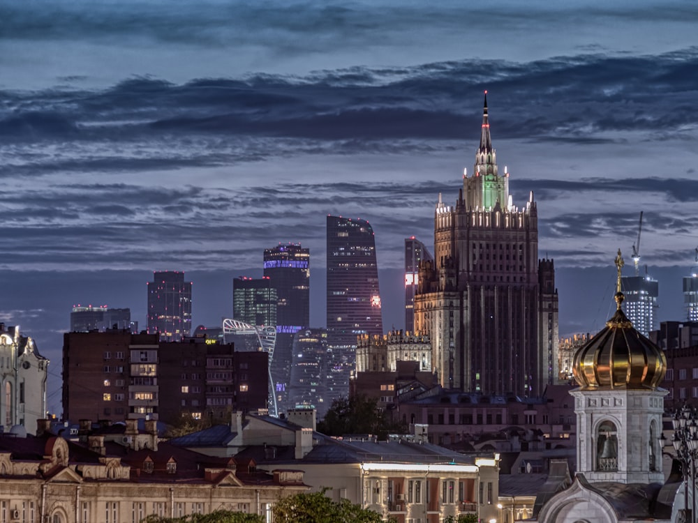 city skyline under blue sky during daytime