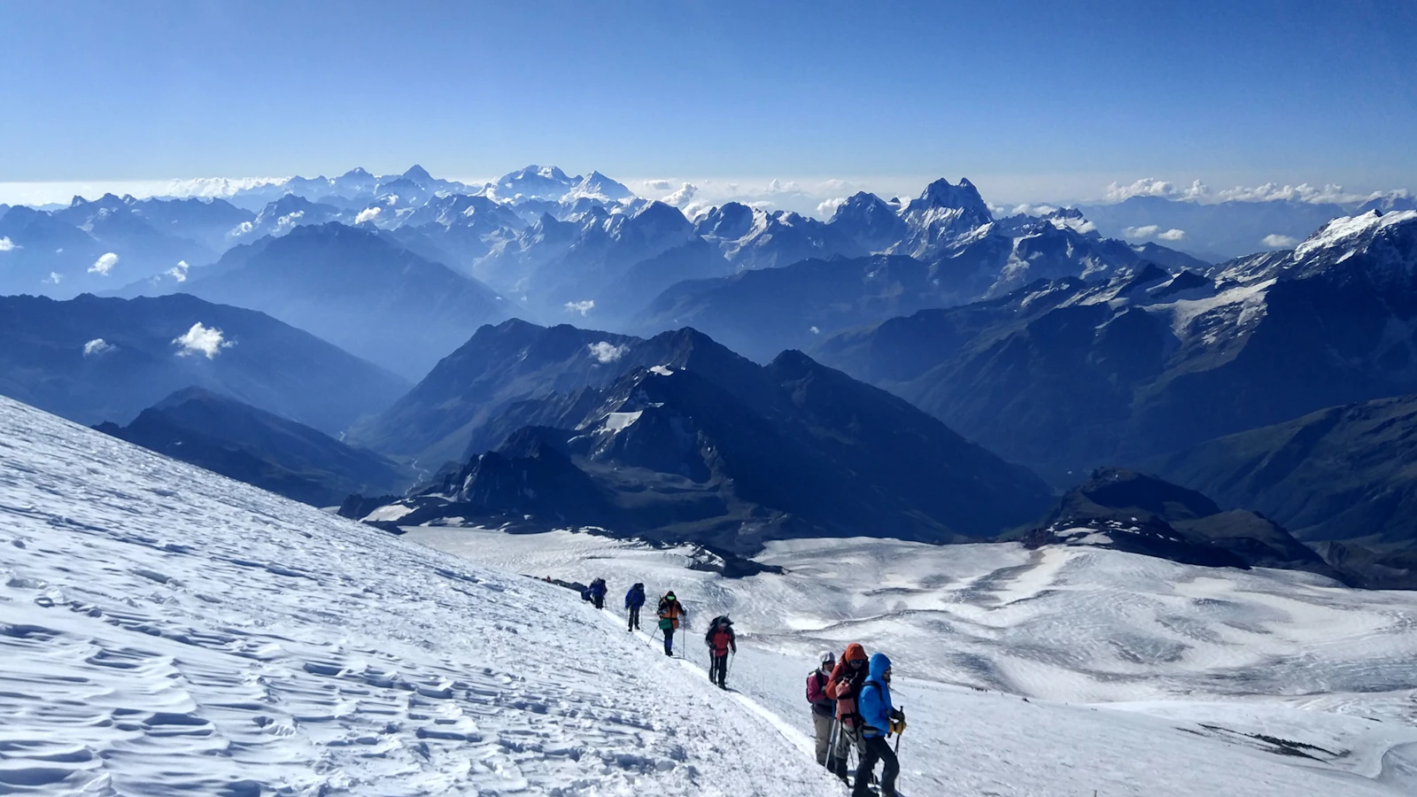 Climbers walking up a snow slope on Elbrus