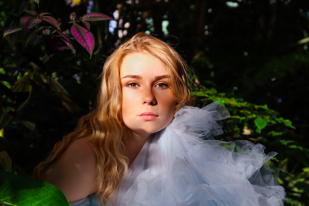 girl in green shirt with white wings