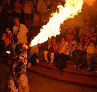 people standing near bonfire during nighttime