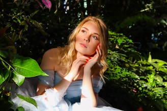 A serene woman sitting peacefully in a sunlit garden, symbolizing healing and renewal.