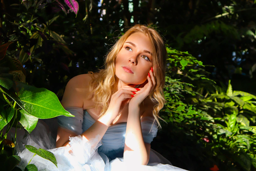 A gentle dam resting peacefully in a sunlit garden, her soft eyes reflecting warmth and care.