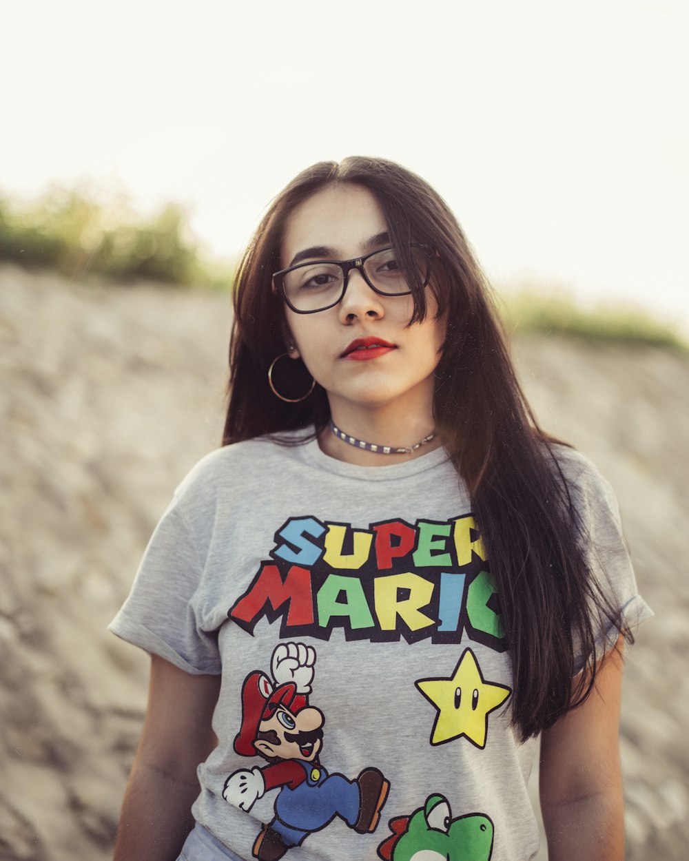 girl in white crew neck t-shirt wearing black framed eyeglasses