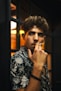 man smoking cigarette in room