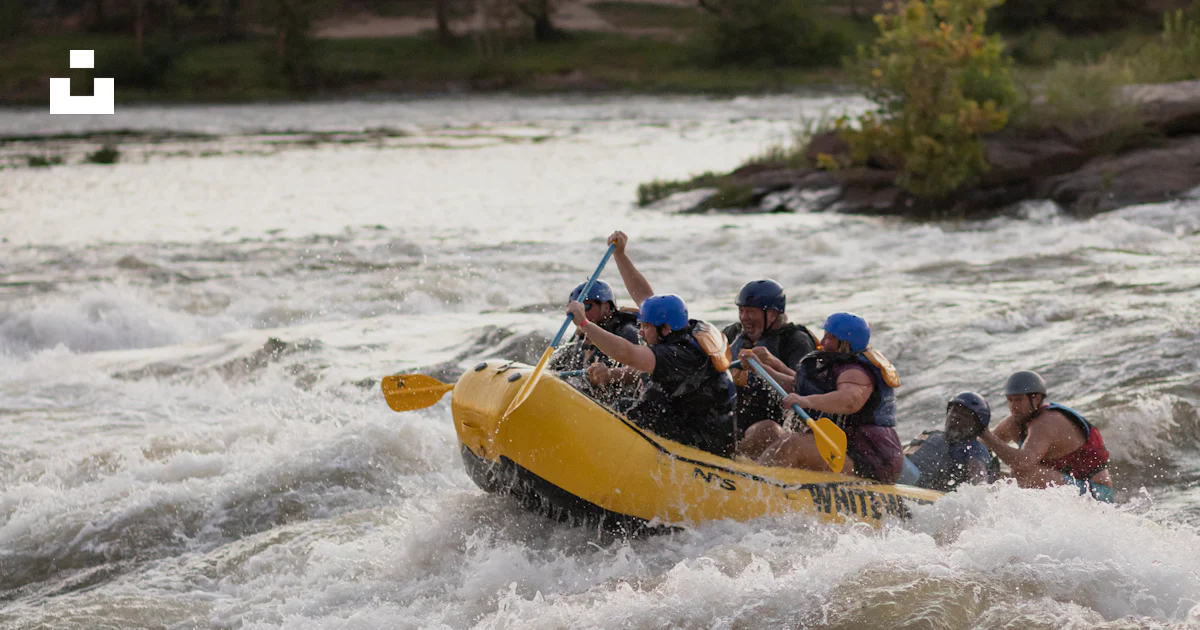 Person Riding Raft A group of people riding a raft down a river photo – Free Human Image ...