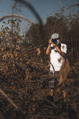 Behind-the-scenes: photographer snapping shots of brush cutting operations on a sunny afternoon.