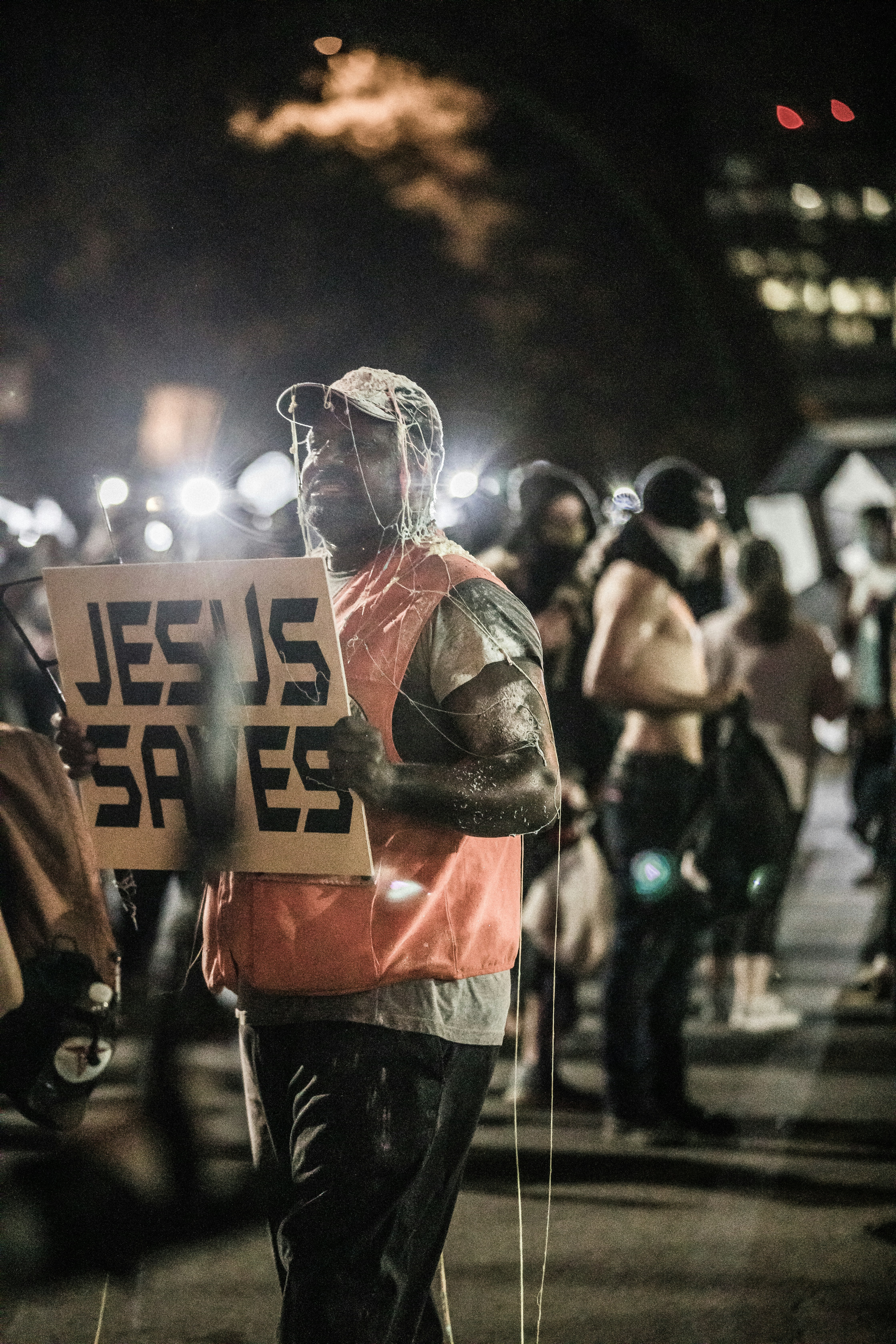 man in red and black jacket wearing helmet