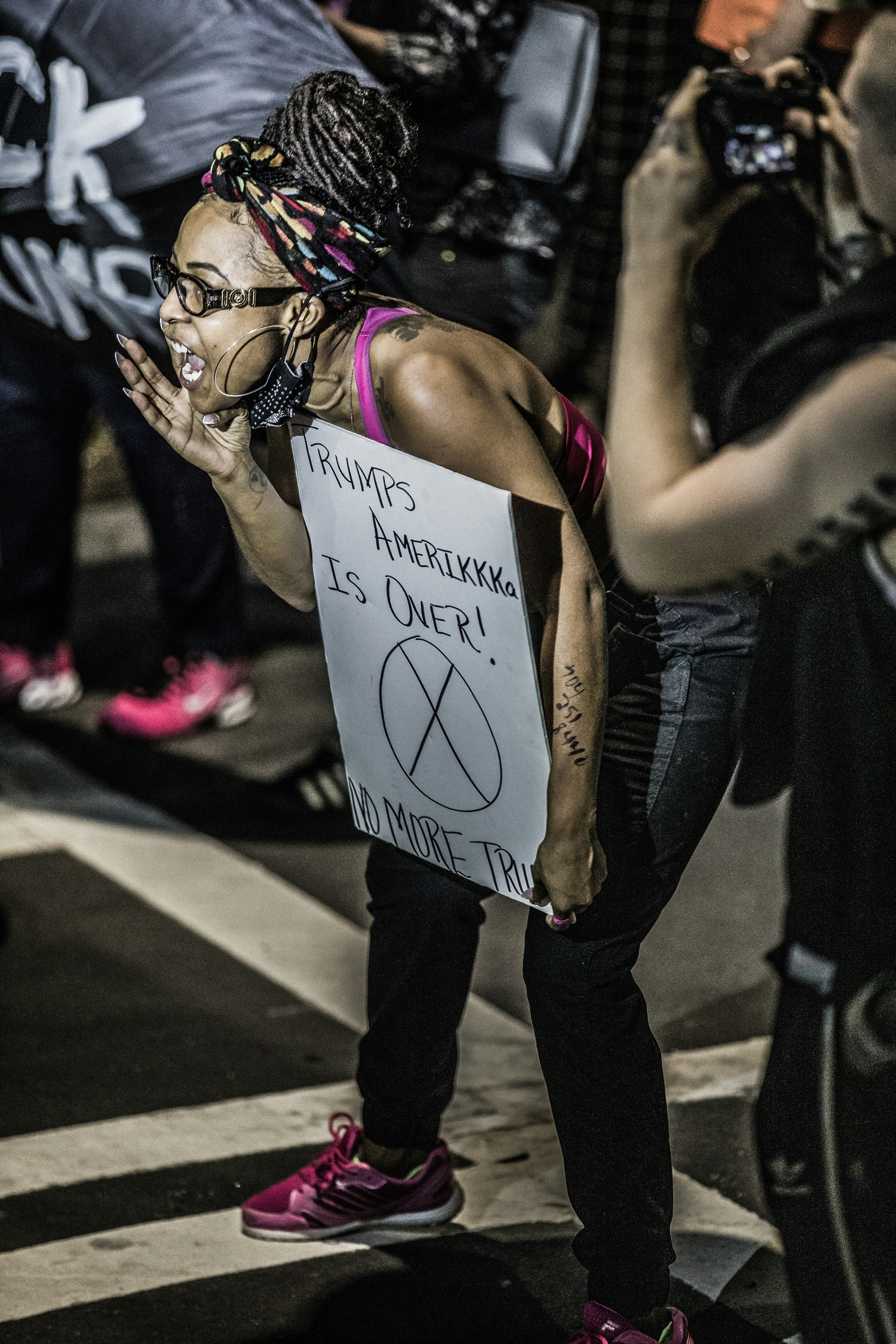 woman in black tank top with tattoo on her back