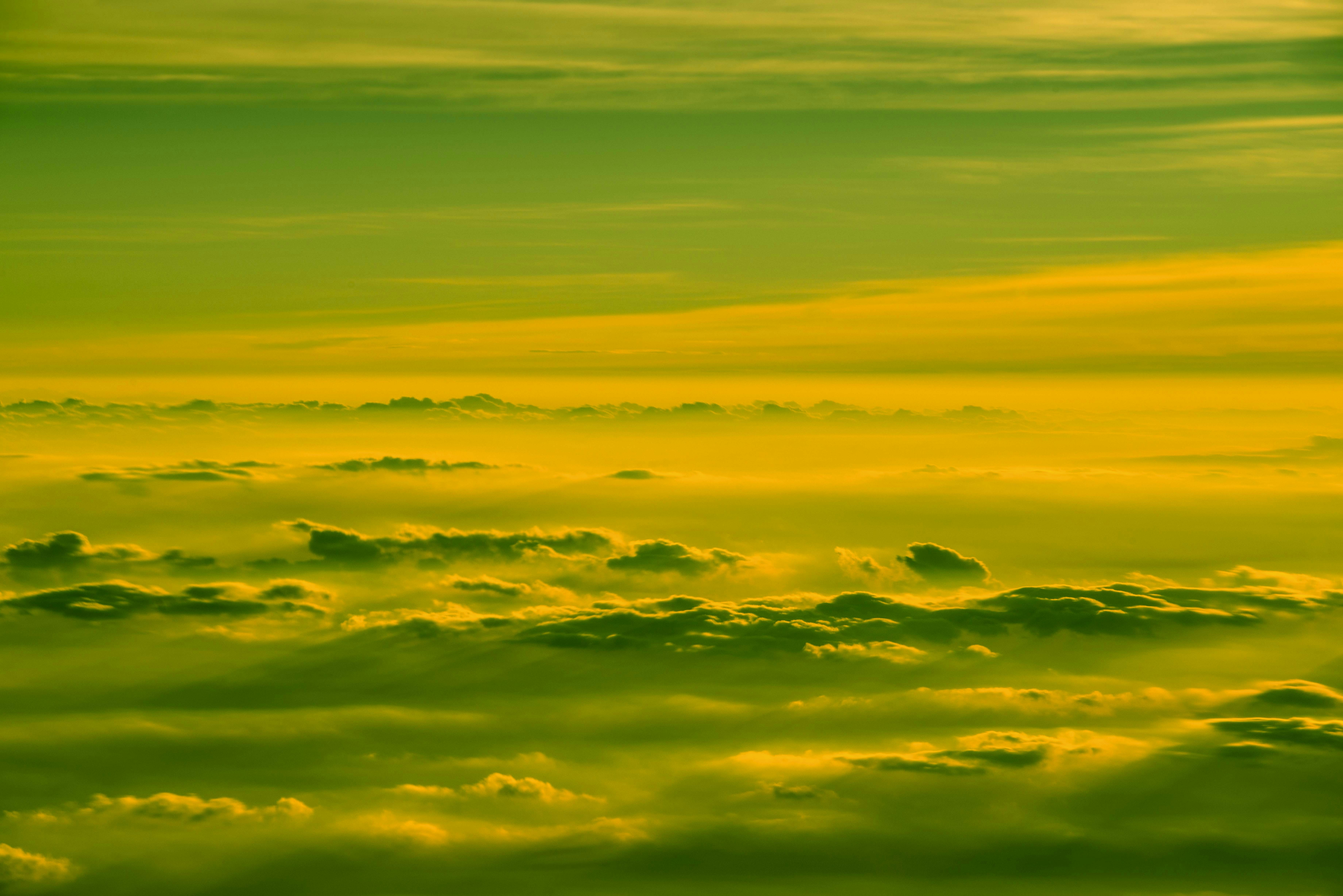 yellow and orange clouds during sunset