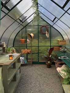 A bright garden scene featuring flowering plants and eco-friendly gardening tools on rustic shelves.