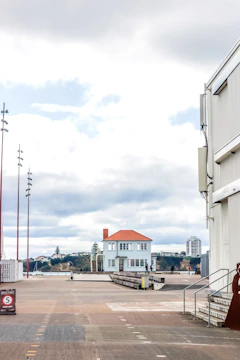 A panoramic shot of a waterfront property with minimalist landscaping.