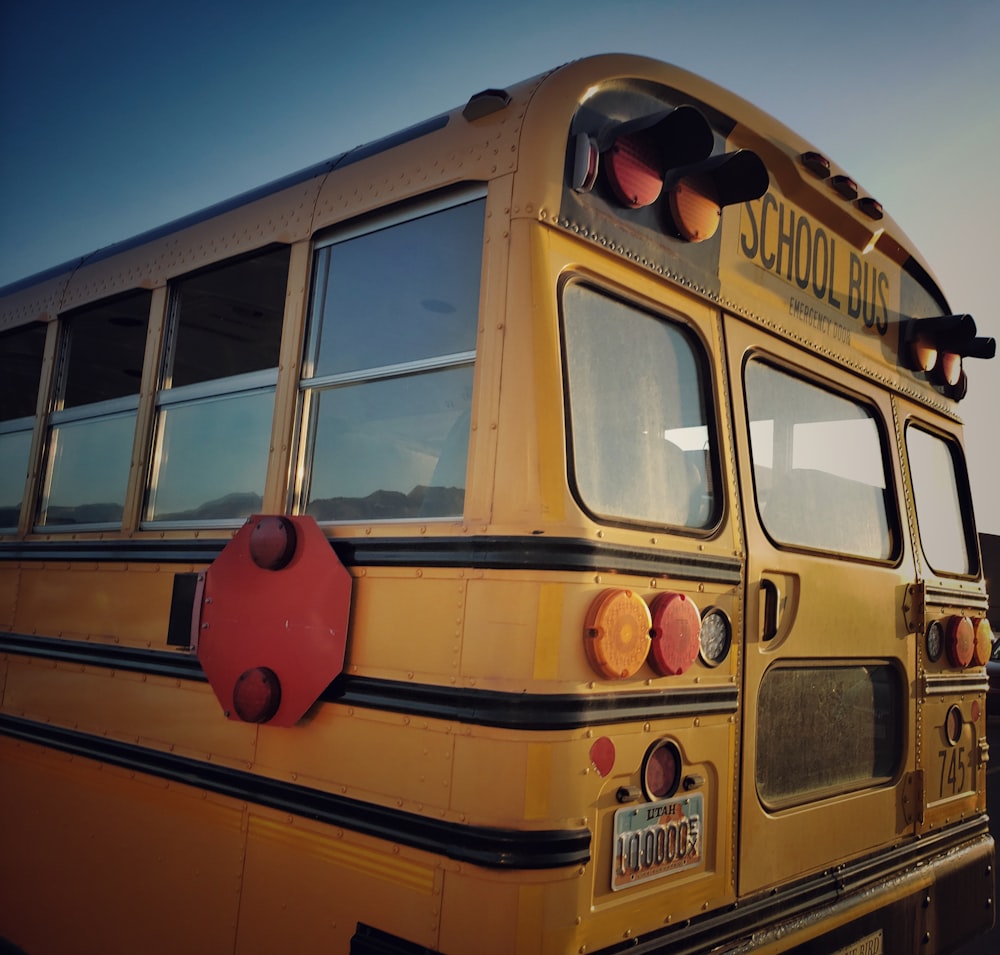 a yellow school bus parked in a parking lot