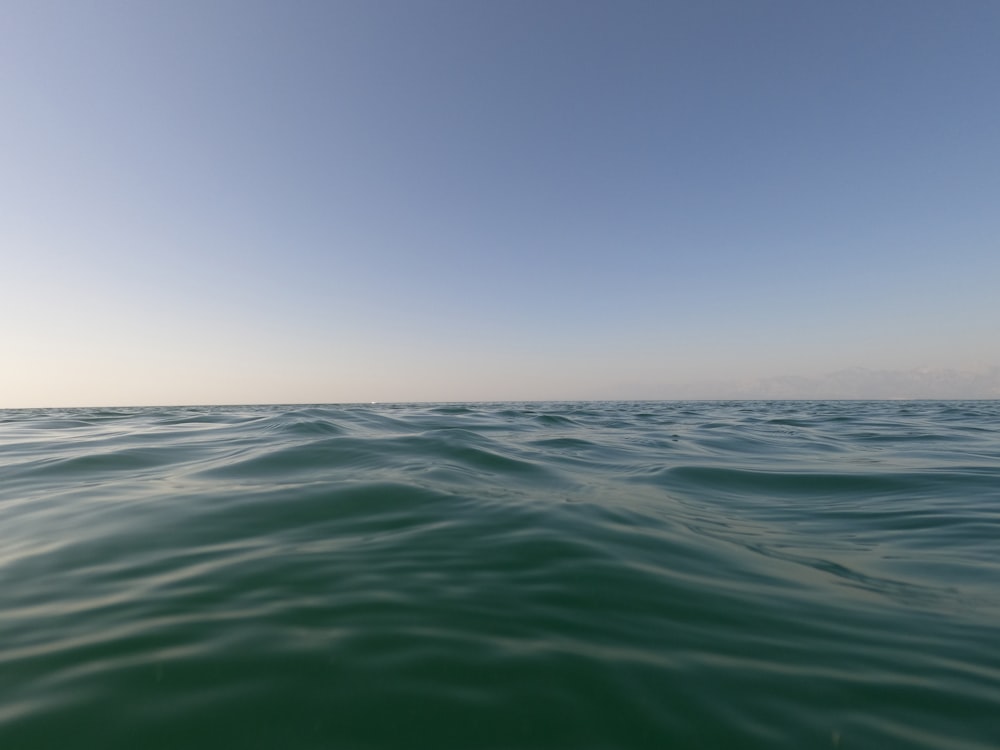 blue sea under blue sky during daytime