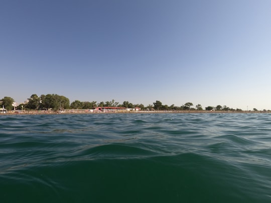 green body of water under blue sky during daytime in Antalya Turkey