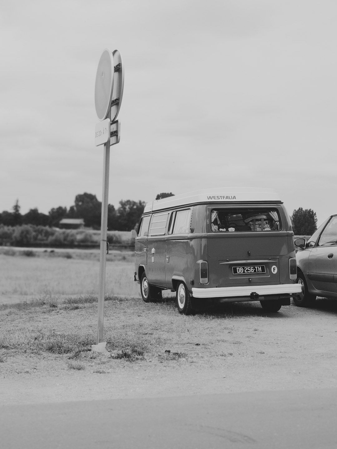 grayscale photo of black mercedes benz van