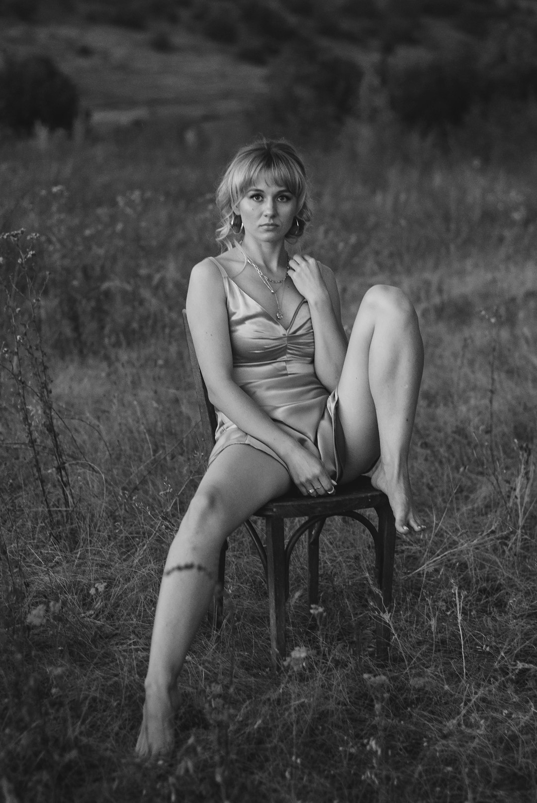 woman in tank top sitting on chair